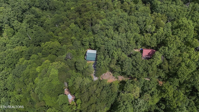 2526 N School House Gap Rd, Sevierville, TN 37876 - aerial view of property and surrounding area featuring a heavily wooded area