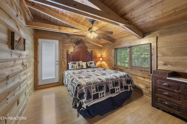 2526 N School House Gap Rd, Sevierville, TN 37876 - bedroom with wood walls, light wood-style flooring, and wooden ceiling