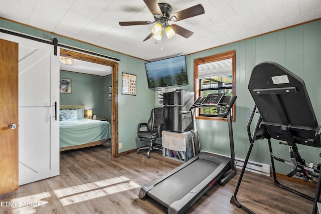 4720 Laws Rd, Del Rio, TN 37727 - workout area featuring wood finished floors, ceiling fan, and a barn door