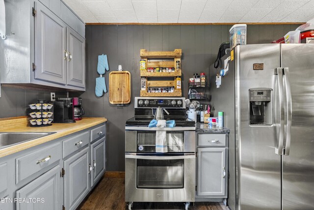 4720 Laws Rd, Del Rio, TN 37727 - kitchen with stainless steel appliances, gray cabinets, and dark wood-type flooring