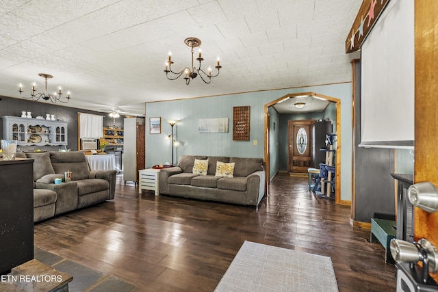4720 Laws Rd, Del Rio, TN 37727 - living area with a chandelier, arched walkways, hardwood / wood-style flooring, and wood walls