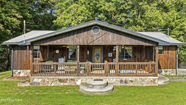 4720 Laws Rd, Del Rio, TN 37727 - view of front facade featuring a front yard, a ceiling fan, and a metal roof