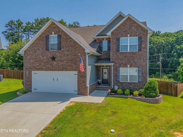 1221 Sky Top Ln, Powell, TN 37849 - view of front facade featuring an attached garage, concrete driveway, brick siding, and roof with shingles