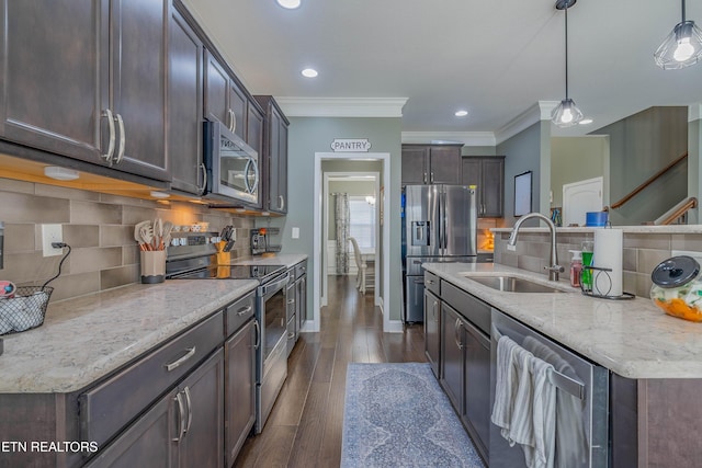 1221 Sky Top Ln, Powell, TN 37849 - kitchen with stainless steel appliances, backsplash, dark brown cabinets, dark wood-type flooring, and decorative light fixtures