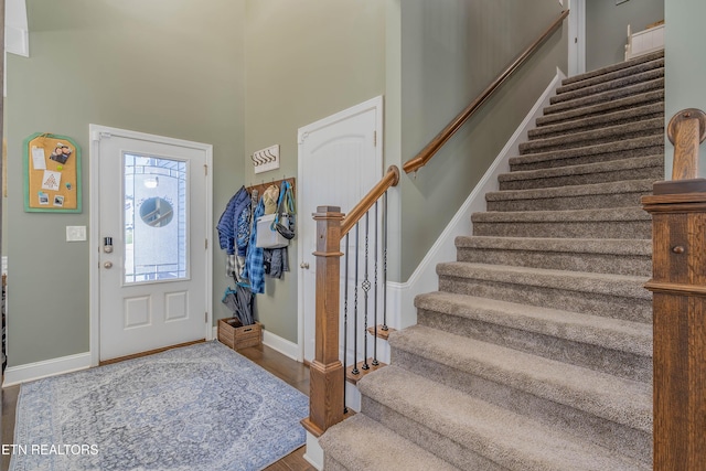 1221 Sky Top Ln, Powell, TN 37849 - foyer entrance featuring stairs, wood finished floors, and a high ceiling