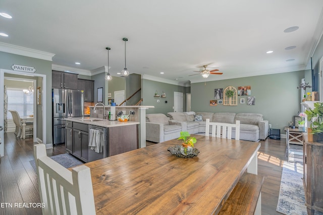 1221 Sky Top Ln, Powell, TN 37849 - dining area featuring ceiling fan, recessed lighting, crown molding, dark wood finished floors, and stairway