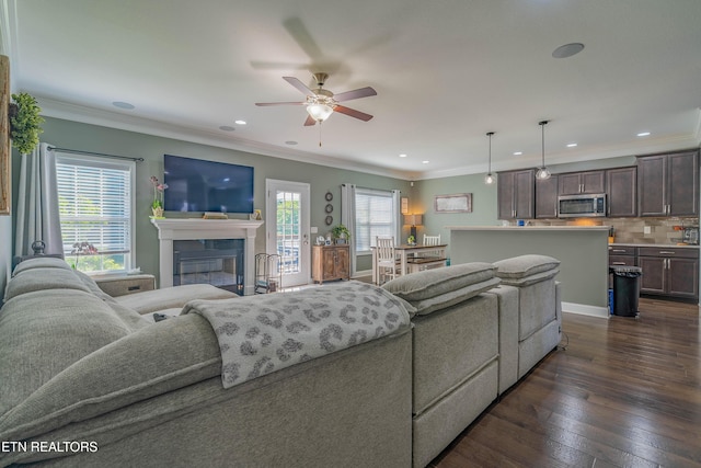 1221 Sky Top Ln, Powell, TN 37849 - living room with a ceiling fan, recessed lighting, a glass covered fireplace, dark wood-style floors, and crown molding