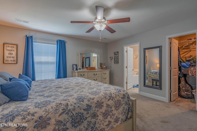 1221 Sky Top Ln, Powell, TN 37849 - bedroom featuring light carpet, a walk in closet, ensuite bathroom, and ceiling fan