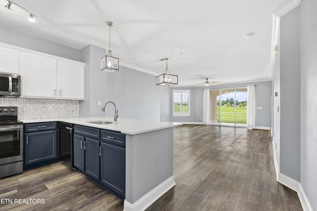 545 Rarity Bay Pkwy Unit 103, Vonore, TN 37885 - kitchen featuring stainless steel appliances, a peninsula, white cabinetry, dark wood finished floors, and crown molding