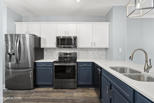 545 Rarity Bay Pkwy Unit 103, Vonore, TN 37885 - kitchen featuring appliances with stainless steel finishes, blue cabinets, white cabinetry, and dark wood-style flooring