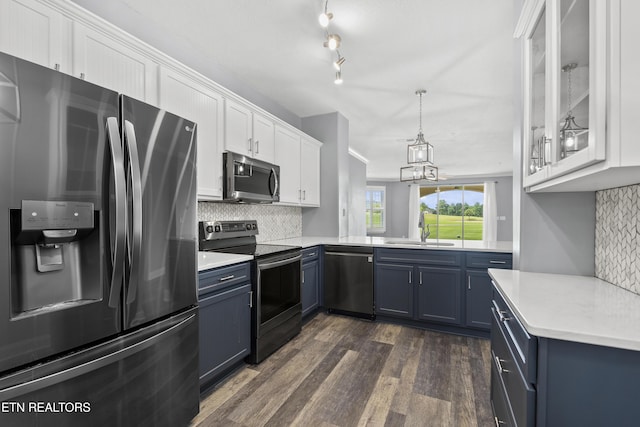 545 Rarity Bay Pkwy Unit 103, Vonore, TN 37885 - kitchen with appliances with stainless steel finishes, blue cabinetry, white cabinetry, and tasteful backsplash