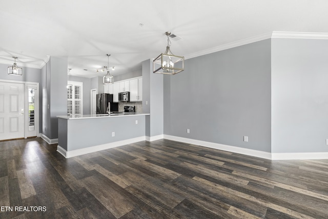 545 Rarity Bay Pkwy Unit 103, Vonore, TN 37885 - kitchen with stainless steel microwave, a chandelier, freestanding refrigerator, white cabinetry, and dark wood-style flooring