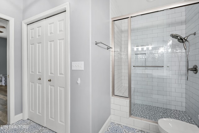 545 Rarity Bay Pkwy Unit 103, Vonore, TN 37885 - full bathroom featuring a stall shower, a closet, and tile patterned floors