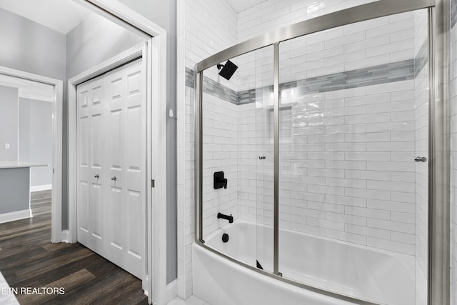 545 Rarity Bay Pkwy Unit 103, Vonore, TN 37885 - bathroom with shower / bath combination with glass door and wood finished floors