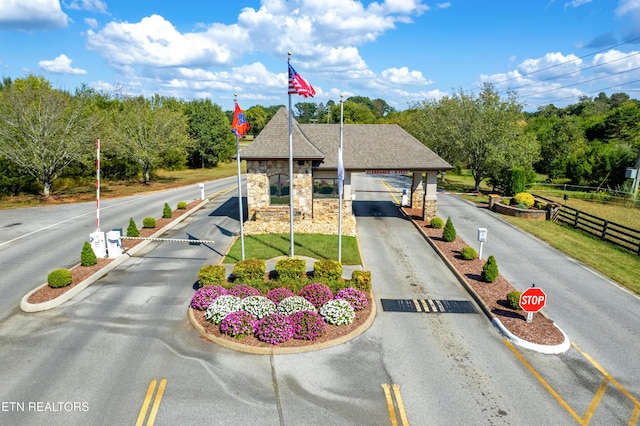 545 Rarity Bay Pkwy Unit 103, Vonore, TN 37885 - view of property with concrete driveway, a carport, and view of wooded area