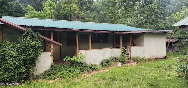 229 Obis Bowling Rd, Robbins, TN 37852 - view of side of home with a wooded view and a metal roof
