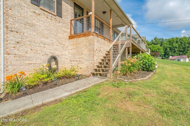 124 Pheasant Rd, Clinton, TN 37716 - view of side of property featuring a yard, brick siding, and stairway