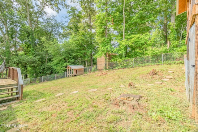 124 Pheasant Rd, Clinton, TN 37716 - fenced backyard featuring an outdoor structure