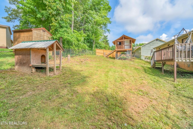 124 Pheasant Rd, Clinton, TN 37716 - fenced backyard with stairs, a deck, and an outdoor structure