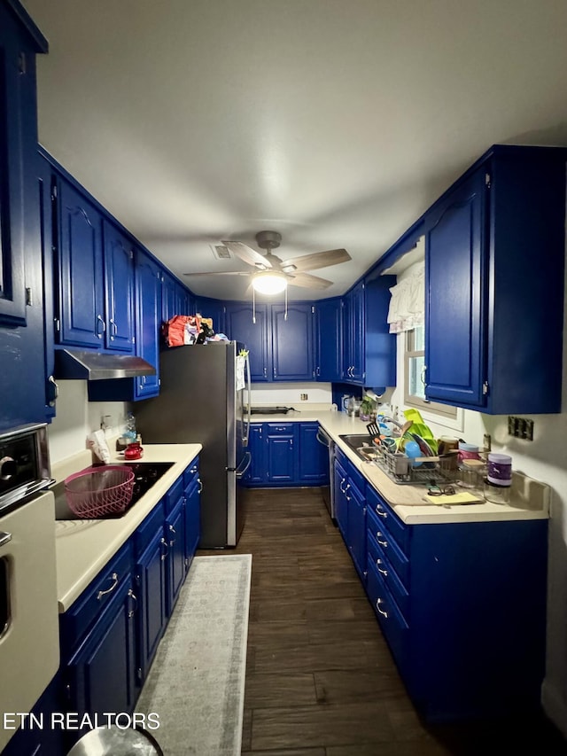 103 Albany Rd, Oak Ridge, TN 37830 - kitchen with under cabinet range hood, stainless steel appliances, blue cabinetry, light countertops, and a ceiling fan