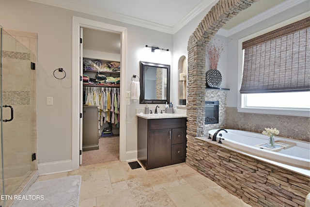 11957 Lakehurst Ln, Knoxville, TN 37934 - full bath featuring vanity, stone tile floors, a garden tub, a stall shower, and ornamental molding