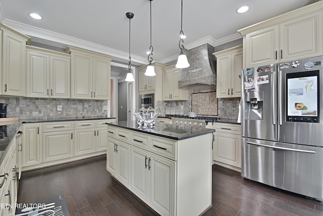 11957 Lakehurst Ln, Knoxville, TN 37934 - kitchen featuring stainless steel appliances, custom range hood, decorative backsplash, cream cabinetry, and crown molding