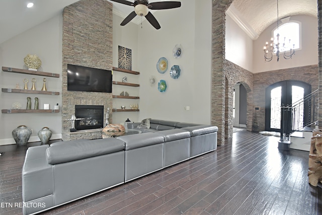 11957 Lakehurst Ln, Knoxville, TN 37934 - living area featuring high vaulted ceiling, arched walkways, a ceiling fan, dark wood-type flooring, and a chandelier