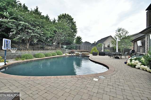 11957 Lakehurst Ln, Knoxville, TN 37934 - view of swimming pool featuring a patio, a fenced backyard, and a pool with connected hot tub