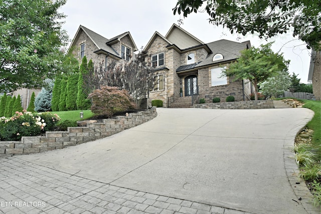 11957 Lakehurst Ln, Knoxville, TN 37934 - view of front of home with brick siding, driveway, and stone siding