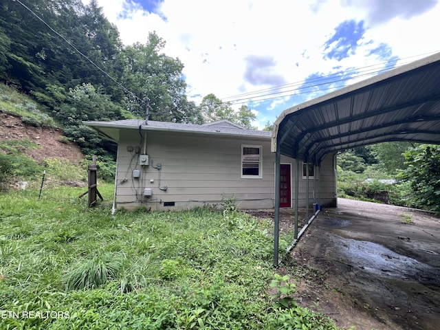 435 Simms Fork Rd, Arjay, KY 40902 - view of side of property with a detached carport and crawl space