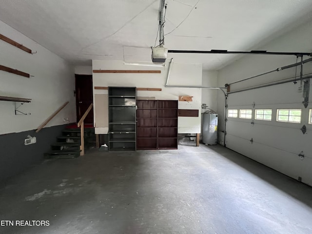 435 Simms Fork Rd, Arjay, KY 40902 - garage featuring electric water heater and a garage door opener