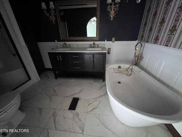 435 Simms Fork Rd, Arjay, KY 40902 - full bathroom with marble finish flooring, a wainscoted wall, a freestanding tub, and double vanity