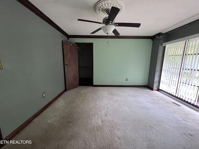 435 Simms Fork Rd, Arjay, KY 40902 - carpeted spare room featuring ceiling fan and ornamental molding