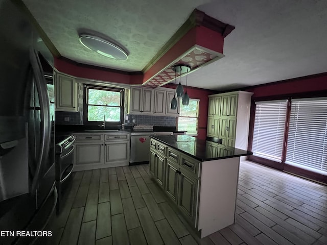 435 Simms Fork Rd, Arjay, KY 40902 - kitchen with freestanding refrigerator, stainless steel dishwasher, dark countertops, healthy amount of natural light, and crown molding