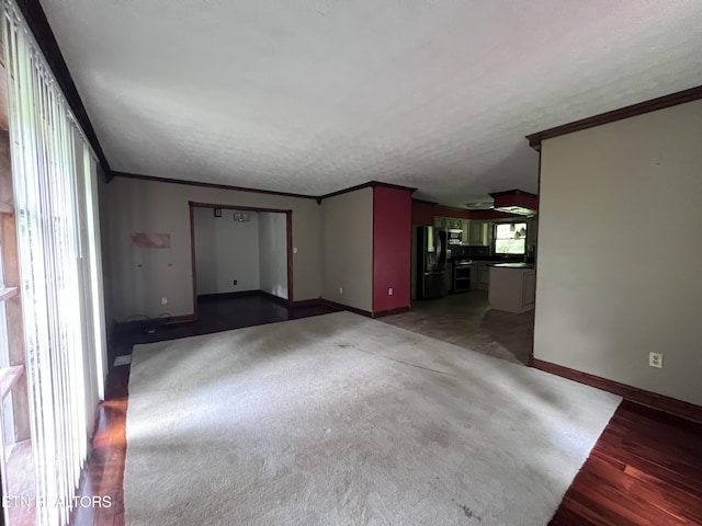 435 Simms Fork Rd, Arjay, KY 40902 - unfurnished living room featuring ornamental molding, wood finished floors, and a textured ceiling