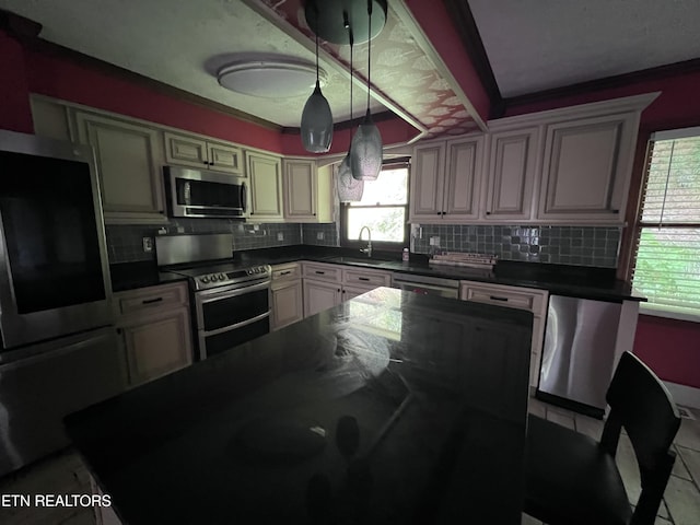435 Simms Fork Rd, Arjay, KY 40902 - kitchen with stainless steel appliances, healthy amount of natural light, dark countertops, and backsplash