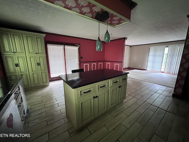 435 Simms Fork Rd, Arjay, KY 40902 - kitchen featuring dark countertops, a kitchen island, decorative light fixtures, cream cabinetry, and crown molding