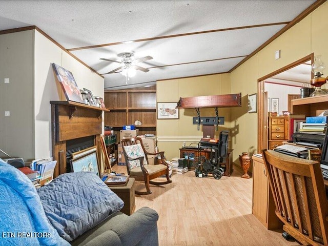 205 Ellison Rd, Lafollette, TN 37766 - living room with ornamental molding, wood finished floors, a ceiling fan, and a glass covered fireplace