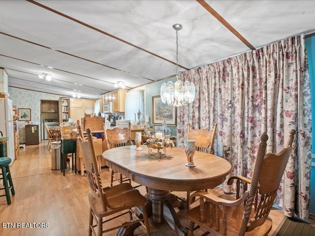205 Ellison Rd, Lafollette, TN 37766 - dining space with wallpapered walls, light wood-type flooring, and a chandelier