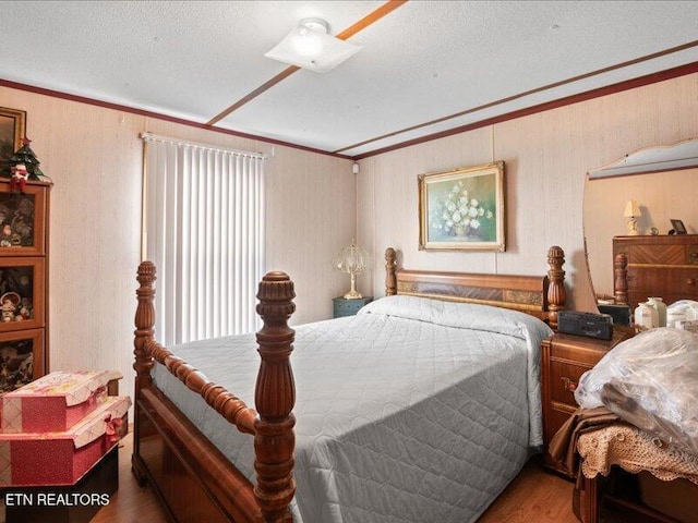 205 Ellison Rd, Lafollette, TN 37766 - bedroom featuring wood finished floors, crown molding, multiple windows, and a textured ceiling