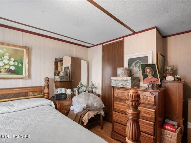 205 Ellison Rd, Lafollette, TN 37766 - bedroom featuring crown molding, wood finished floors, and a textured ceiling