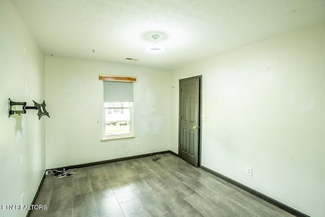 4148 New Home Rd, Smithville, TN 37166 - spare room with baseboards and a textured ceiling