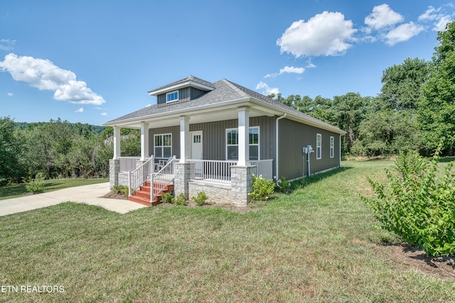 177 Hidden River Ave, Sparta, TN 38583 - bungalow-style home with a porch, a front yard, board and batten siding, and a forest view