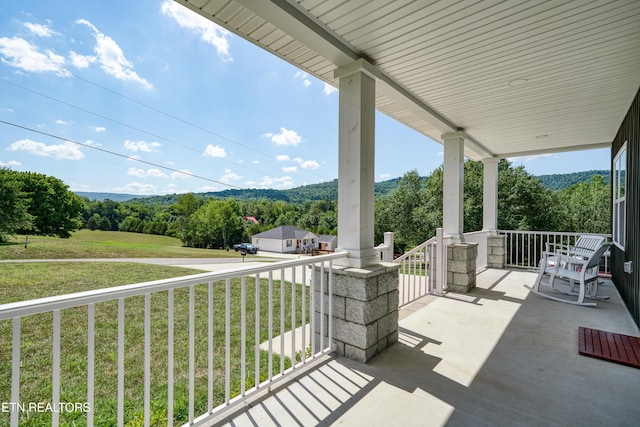 177 Hidden River Ave, Sparta, TN 38583 - covered porch featuring a lawn and a forest view
