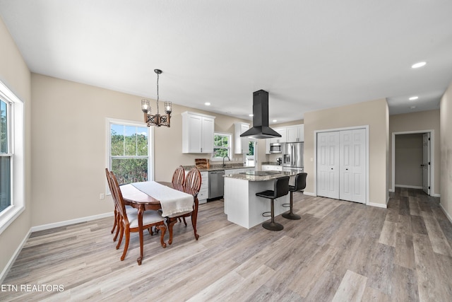 177 Hidden River Ave, Sparta, TN 38583 - dining space featuring light wood finished floors, a chandelier, and recessed lighting