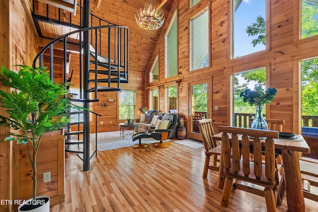 2011 Ridgecrest Loop Ln, Sevierville, TN 37876 - dining area featuring stairs, high vaulted ceiling, wooden walls, light wood finished floors, and wood ceiling