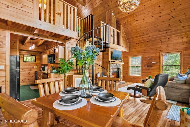2011 Ridgecrest Loop Ln, Sevierville, TN 37876 - dining room with wood walls, high vaulted ceiling, stairs, wood ceiling, and a chandelier