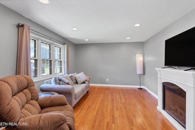 898 W Cunningham St, Alcoa, TN 37701 - living area featuring light wood-style flooring, recessed lighting, and a glass covered fireplace