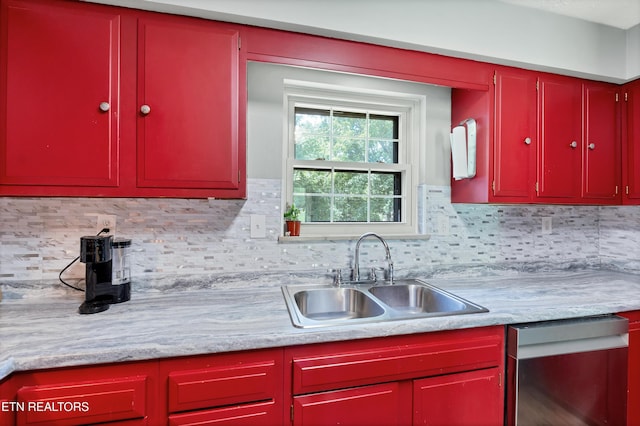 898 W Cunningham St, Alcoa, TN 37701 - kitchen featuring red cabinets, stainless steel dishwasher, light countertops, and backsplash
