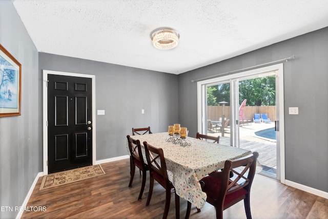 898 W Cunningham St, Alcoa, TN 37701 - dining room featuring dark wood-style flooring and a textured ceiling